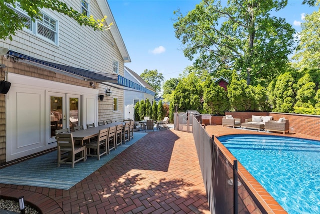 view of pool featuring an outdoor hangout area, outdoor dining area, and a patio