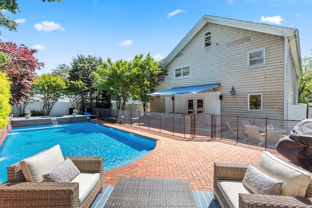 view of swimming pool with a patio area