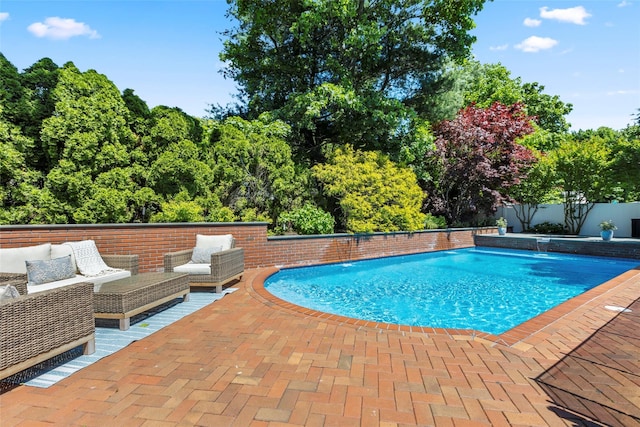 view of pool with a patio, a fenced backyard, and an outdoor living space