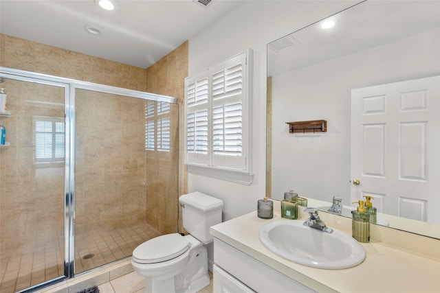 bathroom featuring a stall shower, toilet, vanity, recessed lighting, and tile patterned floors