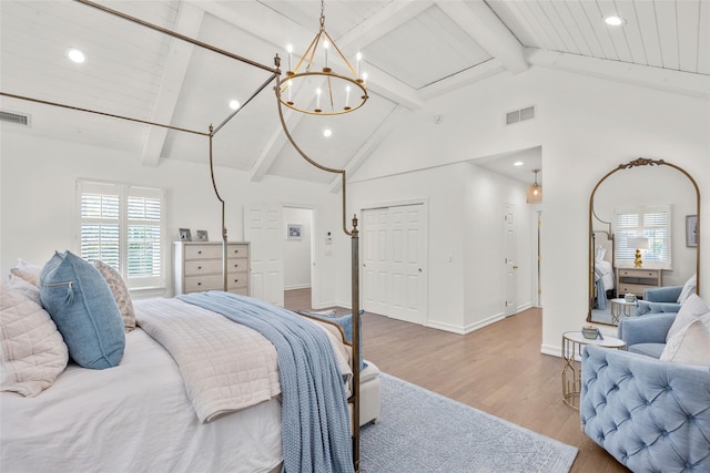 bedroom with wood finished floors, beam ceiling, recessed lighting, high vaulted ceiling, and a chandelier
