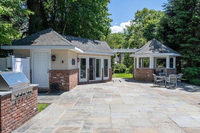 7 Cedar Ln, Glen Cove, NY 11542 - view of patio / terrace with a gazebo, area for grilling, an outbuilding, and outdoor dining space