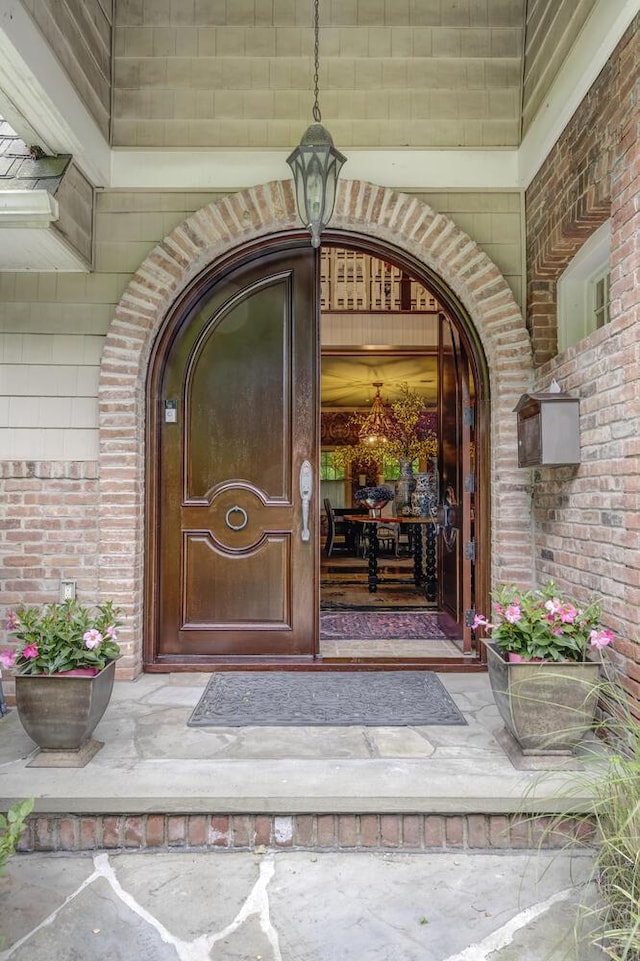 7 Cedar Ln, Glen Cove, NY 11542 - property entrance featuring brick siding