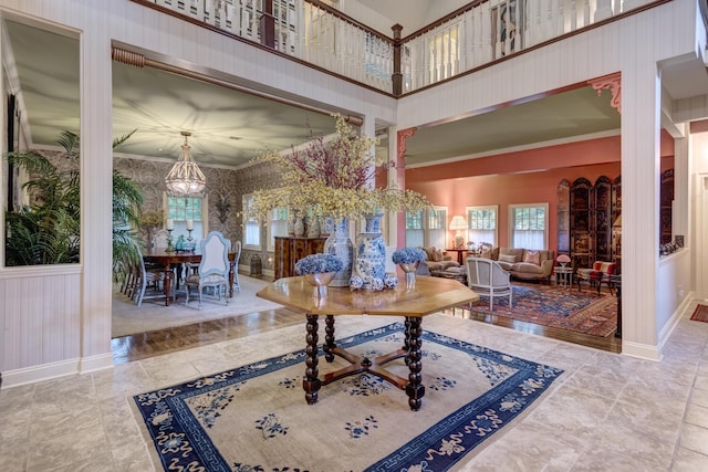 7 Cedar Ln, Glen Cove, NY 11542 - foyer with plenty of natural light, a high ceiling, and wallpapered walls
