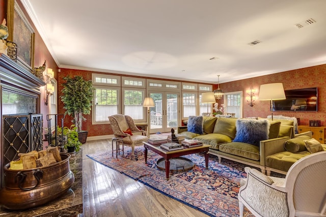 7 Cedar Ln, Glen Cove, NY 11542 - living area featuring wallpapered walls, wood-type flooring, french doors, and ornamental molding