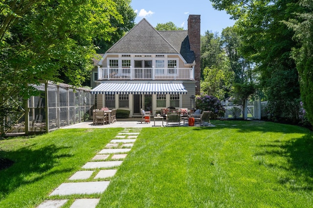7 Cedar Ln, Glen Cove, NY 11542 - back of property with a patio area, a chimney, and an outdoor living space
