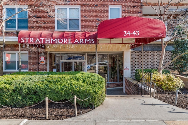 34-43 60th St Unit 4J, Woodside, NY 11377 - view of exterior entry with brick siding