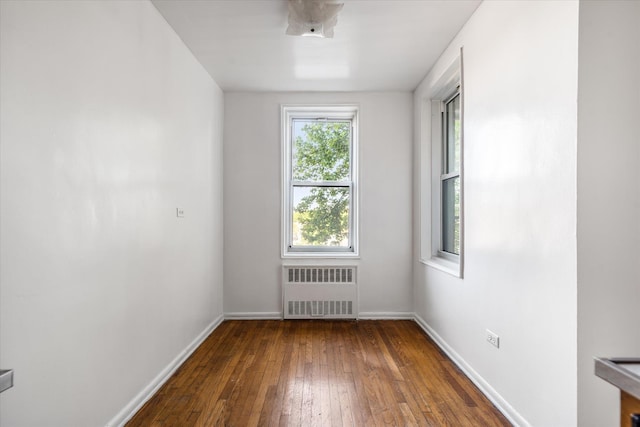 34-43 60th St Unit 4J, Woodside, NY 11377 - spare room with radiator heating unit, baseboards, and hardwood / wood-style floors