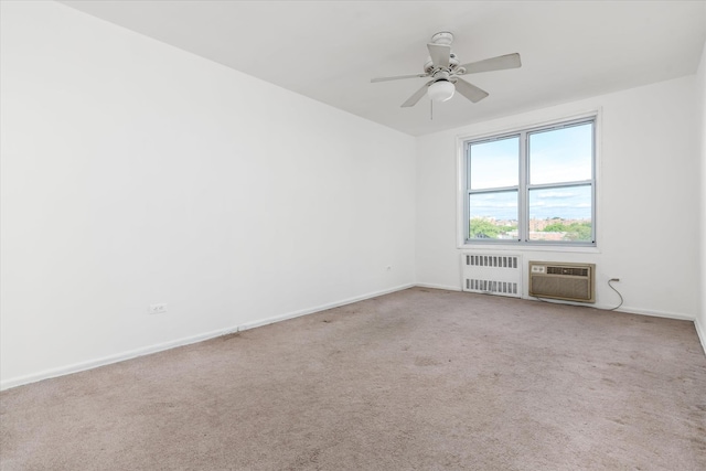34-43 60th St Unit 4J, Woodside, NY 11377 - unfurnished room featuring radiator heating unit, a wall mounted air conditioner, carpet flooring, baseboards, and ceiling fan