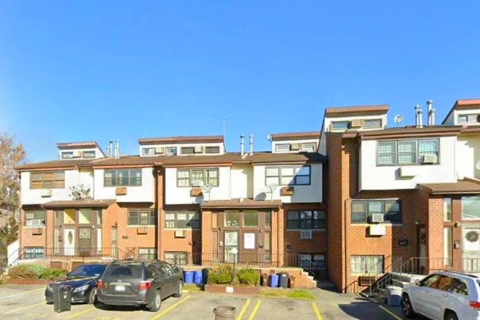 120-15 Cove Ct Unit 90A, College Point, NY 11356 - view of property with uncovered parking