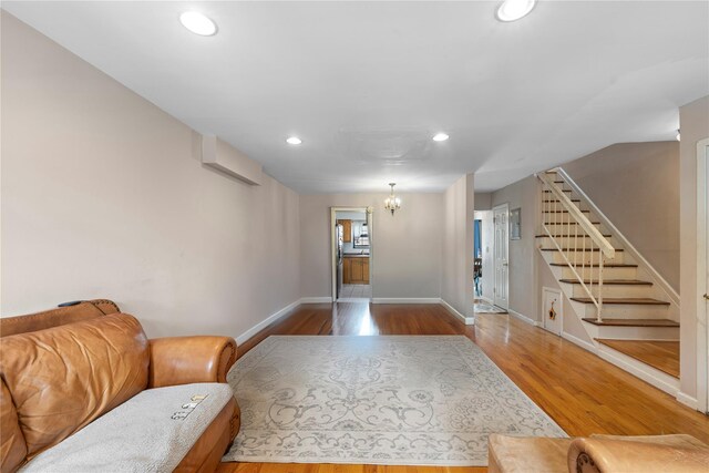 120-15 Cove Ct Unit 90A, College Point, NY 11356 - living room with recessed lighting, stairway, wood finished floors, baseboards, and a chandelier