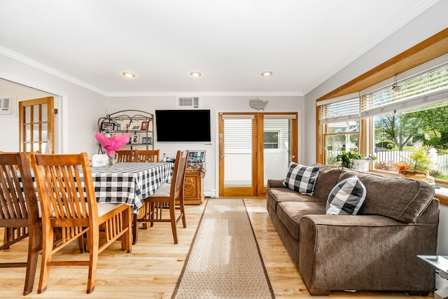 29 Water Ln N, Levittown, NY 11756 - living room featuring light wood finished floors, ornamental molding, a baseboard radiator, and recessed lighting