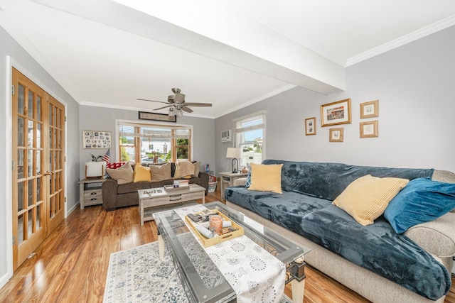29 Water Ln N, Levittown, NY 11756 - living room with light wood-style floors, ornamental molding, a ceiling fan, and baseboards