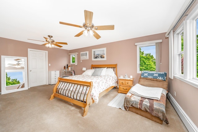 29 Water Ln N, Levittown, NY 11756 - bedroom featuring a baseboard heating unit, carpet flooring, a ceiling fan, and baseboards