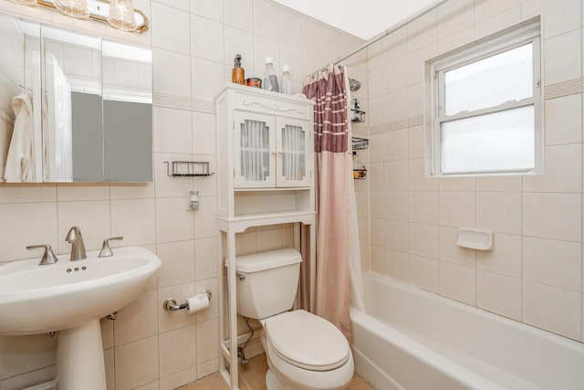 29 Water Ln N, Levittown, NY 11756 - full bathroom with tile walls, toilet, shower / bath combo with shower curtain, and a sink