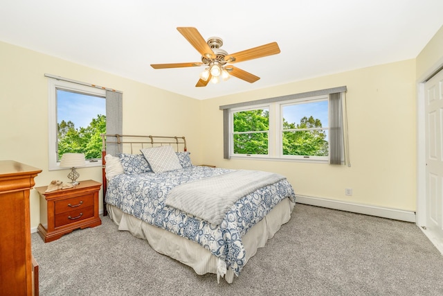 29 Water Ln N, Levittown, NY 11756 - bedroom featuring a baseboard radiator, multiple windows, and carpet