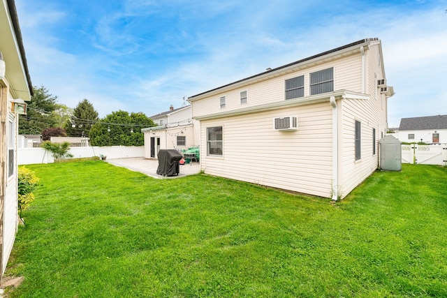 29 Water Ln N, Levittown, NY 11756 - rear view of house with a patio area and a wall mounted AC