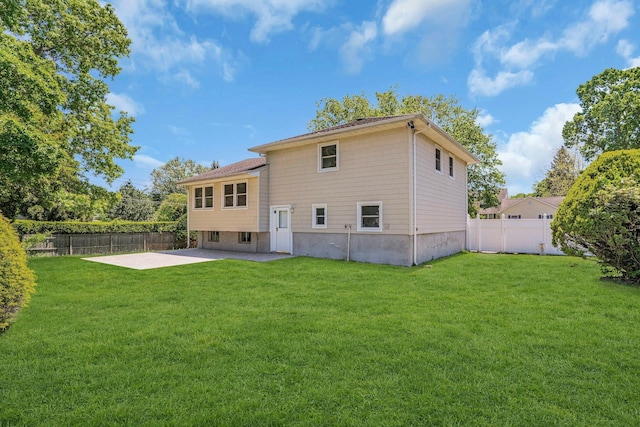 rear view of property featuring a patio