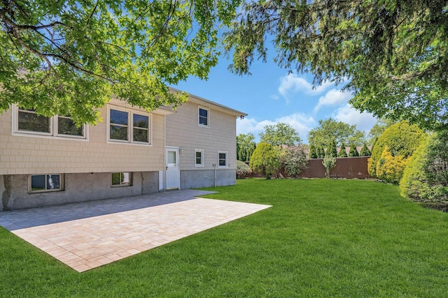 back of property featuring a patio area