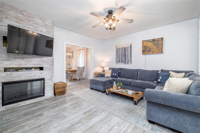 630 W Chester St, Long Beach, NY 11561 - living room with wood finished floors, a ceiling fan, and a fireplace