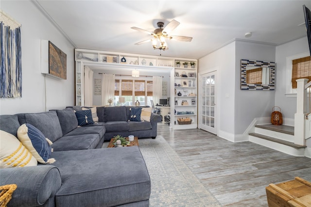 630 W Chester St, Long Beach, NY 11561 - living area with ceiling fan, wood finished floors, baseboards, ornamental molding, and built in features