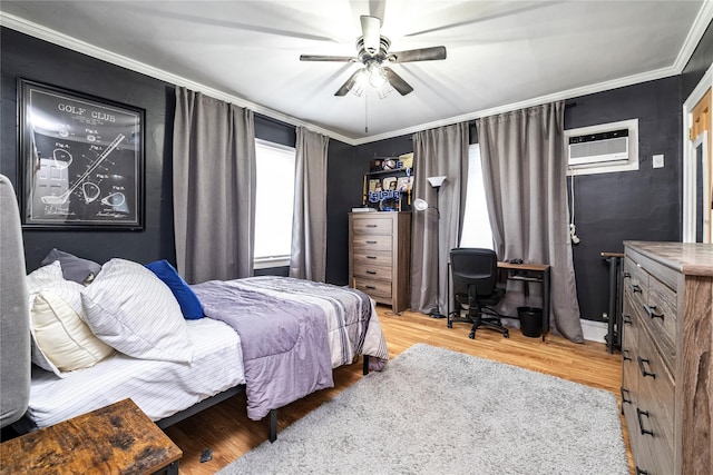 630 W Chester St, Long Beach, NY 11561 - bedroom with wood finished floors, crown molding, ceiling fan, and a wall mounted air conditioner