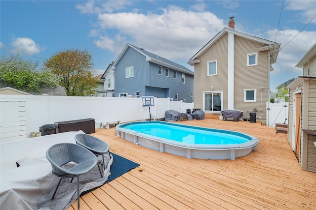 630 W Chester St, Long Beach, NY 11561 - view of pool with a wooden deck, a fenced backyard, and a gate