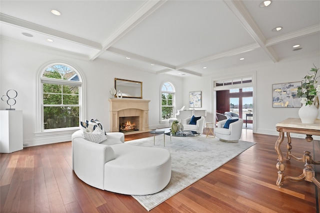 52 Carriglea Dr, Call Listing Agent, CT 06878 - living area with a fireplace with flush hearth, beamed ceiling, wood finished floors, coffered ceiling, and recessed lighting
