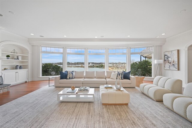 52 Carriglea Dr, Call Listing Agent, CT 06878 - living area featuring crown molding, plenty of natural light, wood finished floors, recessed lighting, and built in features