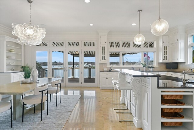 52 Carriglea Dr, Call Listing Agent, CT 06878 - dining room with plenty of natural light, recessed lighting, crown molding, a chandelier, and light wood-style flooring
