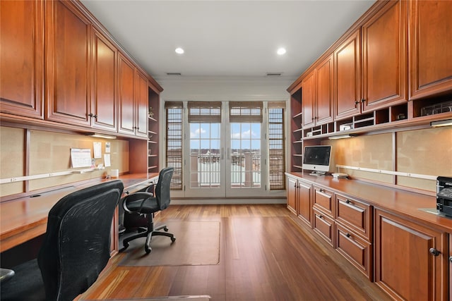 52 Carriglea Dr, Call Listing Agent, CT 06878 - home office featuring built in desk, wood finished floors, ornamental molding, and recessed lighting