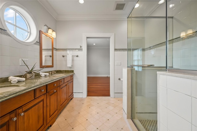 52 Carriglea Dr, Call Listing Agent, CT 06878 - full bathroom featuring tile walls, ornamental molding, a shower stall, double vanity, and recessed lighting