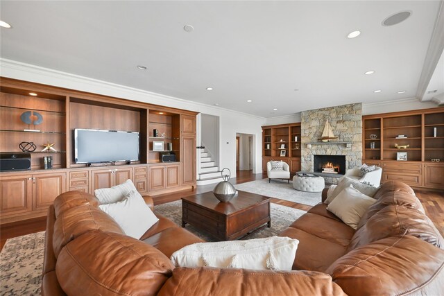52 Carriglea Dr, Call Listing Agent, CT 06878 - living area with crown molding, wood finished floors, a fireplace, recessed lighting, and stairs