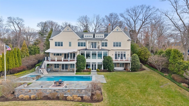 52 Carriglea Dr, Call Listing Agent, CT 06878 - rear view of house with stairway, a yard, a chimney, a patio area, and stucco siding