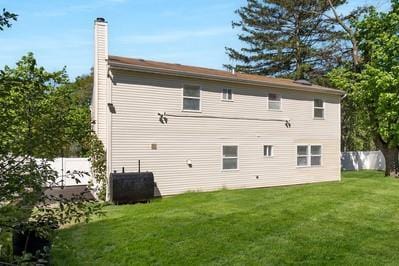 8 Hilltop Ave, West Babylon, NY 11704 - back of property featuring a chimney
