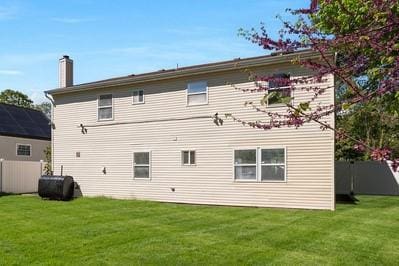 8 Hilltop Ave, West Babylon, NY 11704 - rear view of property with a chimney