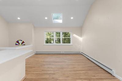8 Hilltop Ave, West Babylon, NY 11704 - unfurnished room featuring baseboard heating, wood finished floors, recessed lighting, and a skylight
