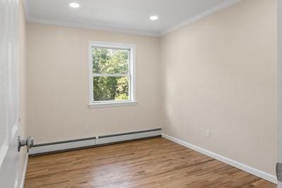 8 Hilltop Ave, West Babylon, NY 11704 - spare room featuring a baseboard heating unit, crown molding, wood finished floors, baseboards, and recessed lighting