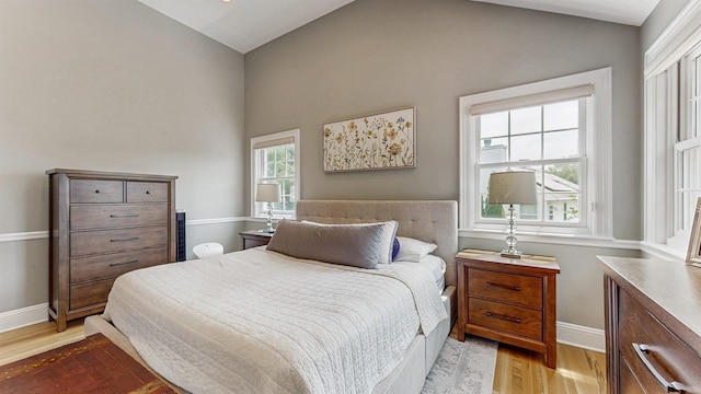 5 Long House Way, Commack, NY 11725 - bedroom with wood finished floors, lofted ceiling, and baseboards