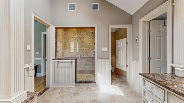 5 Long House Way, Commack, NY 11725 - bathroom featuring a shower stall, vanity, vaulted ceiling, and a wainscoted wall