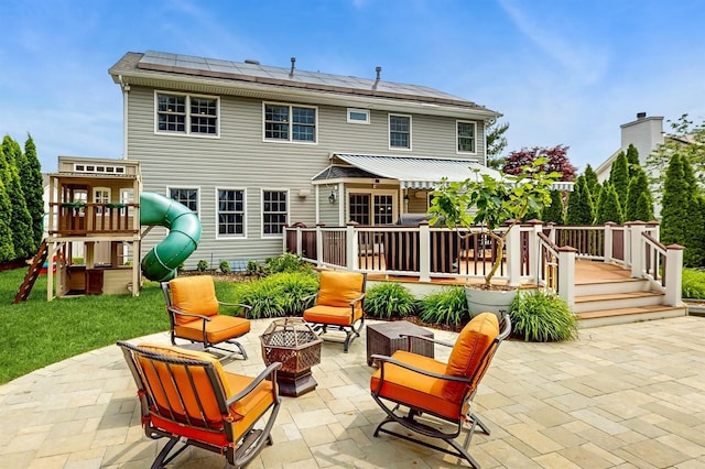 5 Long House Way, Commack, NY 11725 - view of patio / terrace featuring a fire pit, a playground, and a wooden deck