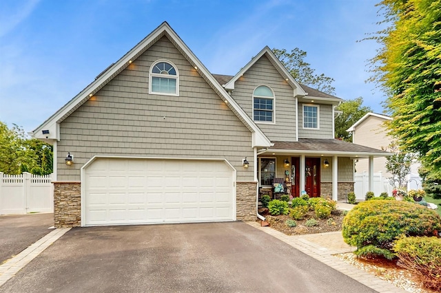 5 Long House Way, Commack, NY 11725 - view of front of home featuring stone siding, driveway, a porch, and an attached garage