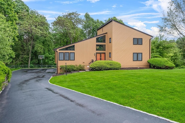 30 Apple Hill Dr, Cortlandt Manor, NY 10567 - view of front of home with a front lawn and asphalt driveway
