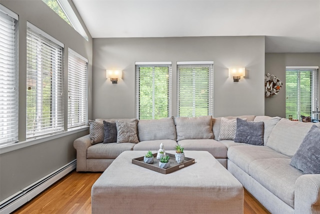 30 Apple Hill Dr, Cortlandt Manor, NY 10567 - living room featuring a baseboard heating unit, light wood-style floors, and lofted ceiling