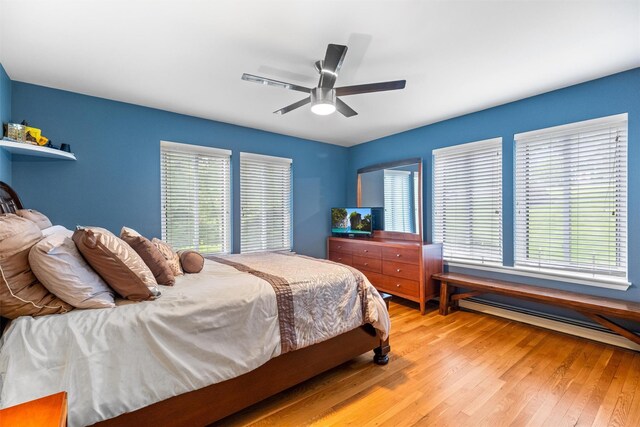 30 Apple Hill Dr, Cortlandt Manor, NY 10567 - bedroom with hardwood / wood-style floors, a baseboard radiator, and ceiling fan