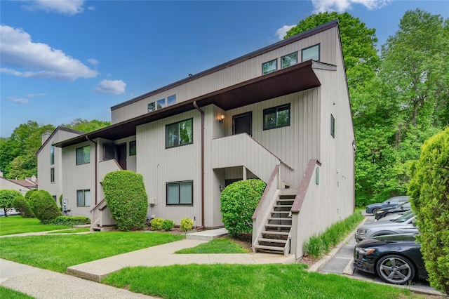 324 N Greeley Ave, Chappaqua, NY 10514 - view of property with stairway and uncovered parking