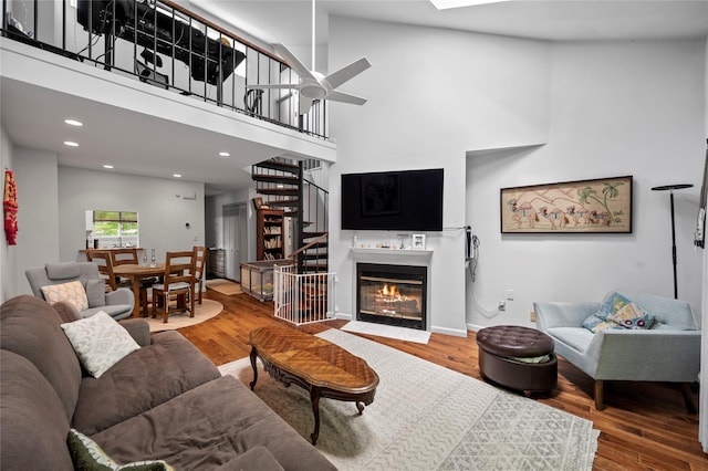 324 N Greeley Ave, Chappaqua, NY 10514 - living area with stairway, wood finished floors, ceiling fan, recessed lighting, and a high ceiling