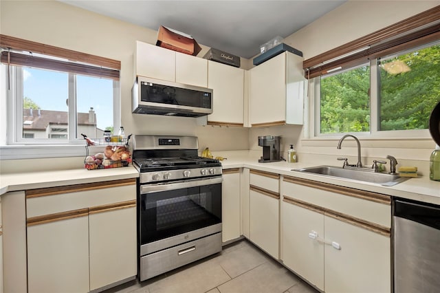324 N Greeley Ave, Chappaqua, NY 10514 - kitchen with appliances with stainless steel finishes, a sink, light countertops, and light tile patterned flooring