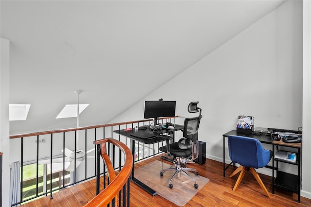 324 N Greeley Ave, Chappaqua, NY 10514 - home office with a skylight, wood finished floors, vaulted ceiling, and baseboards