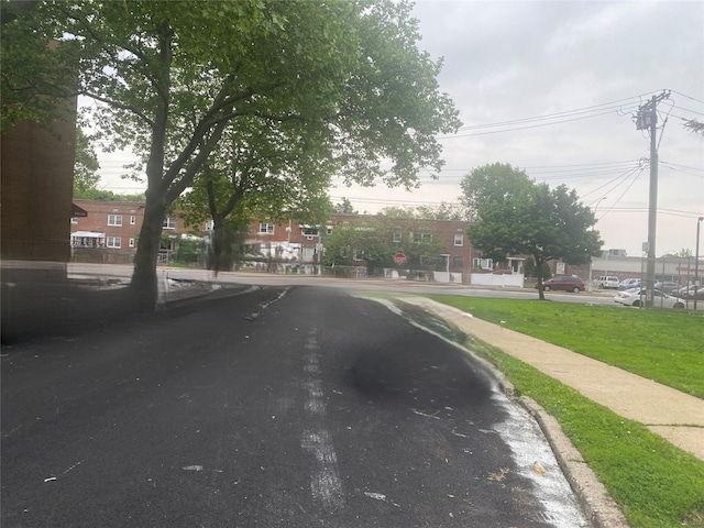 205-28 116th Rd, Saint Albans, NY 11412 - view of asphalt road with sidewalks, curbs, and traffic signs